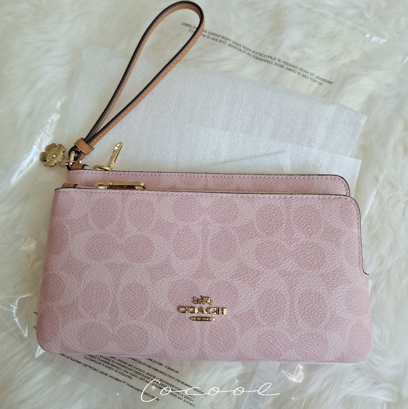 Coach Handbags - NWT Coach Double Zip Wristlet In Signature Canvas With Floral Charms Powder Pink